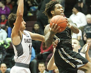 William D. Lewis The vindicator  HArding's Lynn Bowden(4) drives past Boardman's MAustin Barone(11) during 12022016 action at Boardman.