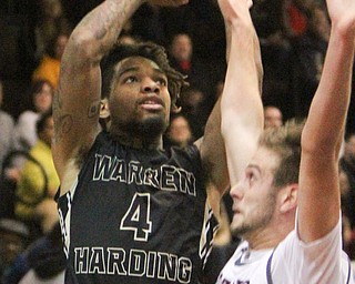William D. Lewis The vindicator  HArding's Lynn Bowden(4) shoots past Boardman's John Ryan(1) during 12022016 action at Boardman.