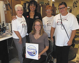 SPECIAL TO THE VINDICATOR
Austintown Junior Women’s League of the Greater Federation of Women’s Clubs of Ohio recently hosted an event on behalf of the charity Locks of Love at the Change About Salon in Austintown. Participants who donated at least 10 inches of hair were treated to a free hairstyle. The donated hair was then sent to Locks of Love, which uses the hair to make wigs for children undergoing cancer treatment. The event featured a basket raffle, a bake sale, 50-50 raffle and music provided by DJ Mark Cole. The event raised $1,600 and will sponsor a child in need. From left are Donna Wear, Ruty Rodriguez-Patterson, Janie Surman and Chrissy Bloom. Jessica Munger, seated, donated more than 10 inches of hair.