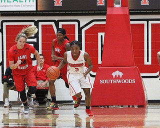 (Nikos Frazier | The Vindicator)..Youngstown State University Penguins junior guard Indiya Benjamin(3) charges towards the basket during the first half as Youngstown State University takes on Saint Francis University at the Beeghly Center in Youngstown on Saturday, Dec. 3, 2016.
