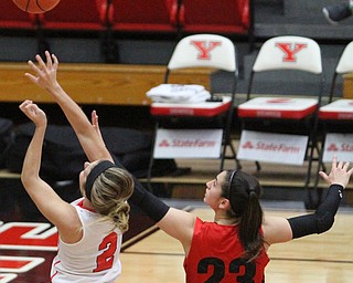 (Nikos Frazier | The Vindicator)..Youngstown State University Penguins sophomore forward Alison Smolinski(2) goes up for the layup as Saint Francis University Red Flash sophomore guard Jessica Kovatch(23) attempts to block her shot during the first half as Youngstown State University takes on Saint Francis University at the Beeghly Center in Youngstown on Saturday, Dec. 3, 2016.
