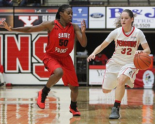 (Nikos Frazier | The Vindicator)..Youngstown State University Penguins senior guard Jenna Hirsch(32) attempts to shake Saint Francis University Red Flash senior guard Samiah Bethel(50) during the second half as Youngstown State University takes on Saint Francis University at the Beeghly Center in Youngstown on Saturday, Dec. 3, 2016.