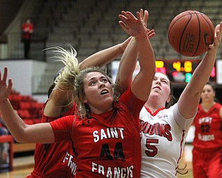 (Nikos Frazier | The Vindicator)..Saint Francis University Red Flash junior guard Halee Adams(44) and Youngstown State University Penguins freshman forward Mary Dunn(15) fight for the rebound during the second half as Youngstown State University takes on Saint Francis University at the Beeghly Center in Youngstown on Saturday, Dec. 3, 2016.