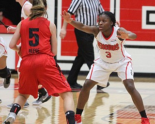 (Nikos Frazier | The Vindicator)..Youngstown State University Penguins junior guard Indiya Benjamin(3) attempts to blovk Saint Francis University Red Flash senior guard Katie Reese(5) during the second halfas Youngstown State University takes on Saint Francis University at the Beeghly Center in Youngstown on Saturday, Dec. 3, 2016.