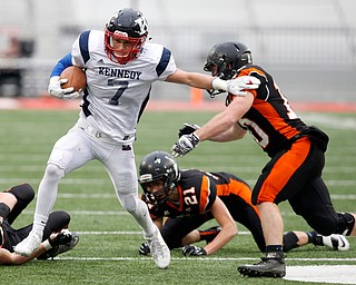 Warren John F. Kennedy's Evan Boyd (7) tries to get past Minster's Bryce Schmiesing (10) during second quarter of the OHSAA Div. VII championship high school football game Saturday, Dec. 3, 2016, in Columbus, Ohio. (Paul Vernon)..
