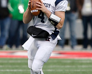 Warren John F. Kennedy's Gregory Valent (4) looks to pass against  Minster during the second quarter of the OHSAA Div. VII championship high school football game Saturday, Dec. 3, 2016, in Columbus, Ohio. (Paul Vernon)..