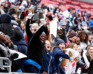 Warren John F. Kennedy fans react to Evan Boyd's touchdown against Minster during the fourth quarter of the OHSAA Div. VII championship high school football game Saturday, Dec. 3, 2016, in Columbus, Ohio. Warren John F. Kennedy won 24-6. (Paul Vernon)..