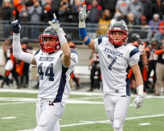 Warren John F. Kennedy's Jacob Coates (44) and Evan Boyd (7) celebrate the Eagles 24-6 OHSAA Div. VII championship high school football game win over Minster Saturday, Dec. 3, 2016, in Columbus, Ohio. (Paul Vernon)..