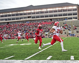 JACKSONVILLE, ALABAMA - DECEMBER 3, 2016: Running back Jody Webb #20 of YSU sprints to the end zone to score a touchdown ahead of defensive back Martavious Williams #36 of Jacksonville State during the first half of their game Saturday afternoon at Burgess-Snow Field. YSU won 40-24. DAVID DERMER | THE VINDICATOR