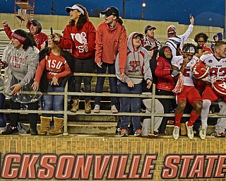JACKSONVILLE, ALABAMA - DECEMBER 3, 2016: Receiver Alvin Bailey #5 and tight end Kevin Rader #83 of YSU sit on the railing while celebrating with YSU students after their game Saturday afternoon at Burgess-Snow Field. YSU won 40-24. DAVID DERMER | THE VINDICATOR
