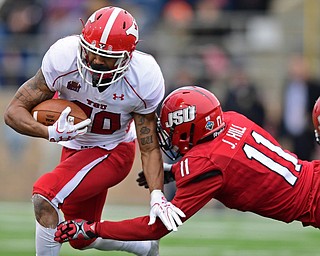 JACKSONVILLE, ALABAMA - DECEMBER 3, 2016: Running back Jody Webb #20 of YSU runs the football while being hit by Jaylen Hill #11 of Jacksonville State during the first half of their game Saturday afternoon at Burgess-Snow Field. YSU won 40-24. DAVID DERMER | THE VINDICATOR