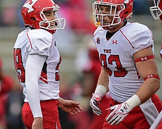 JACKSONVILLE, ALABAMA - DECEMBER 3, 2016: Kicker Zak Kennedy #99 of YSU smiles after a successful field goal during the first half of their game Saturday afternoon at Burgess-Snow Field. YSU won 40-24. DAVID DERMER | THE VINDICATOR..Tight end Kevin Rader #83 of YSU pictured.