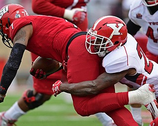 JACKSONVILLE, ALABAMA - DECEMBER 3, 2016: Quarterback Eli Jenkins #7 of Jacksonville State is tackled by safety Jameel Smith #26 of YSU during the first half of their game Saturday afternoon at Burgess-Snow Field. YSU won 40-24. DAVID DERMER | THE VINDICATOR
