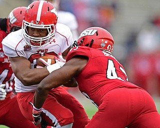 JACKSONVILLE, ALABAMA - DECEMBER 3, 2016: Running back Tevin McCaster #37 of YSU runs the ball while being hit by safety Marlon Bridges #43 of Jacksonville State during the first half of their game Saturday afternoon at Burgess-Snow Field. YSU won 40-24. DAVID DERMER | THE VINDICATOR