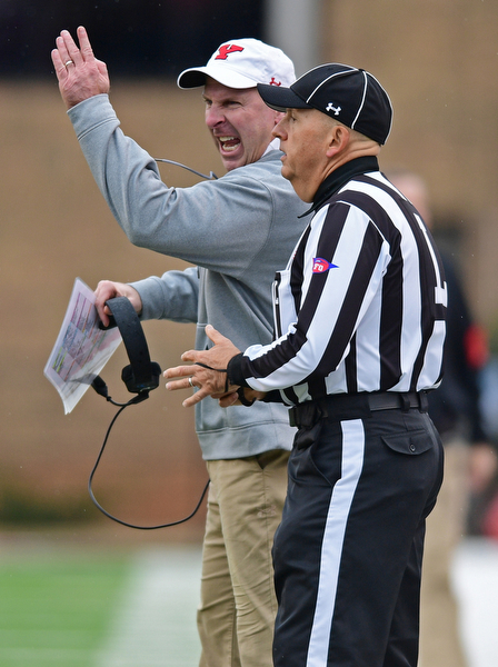 JACKSONVILLE, ALABAMA - DECEMBER 3, 2016: Head coach Bo Pelini of YSU disputes a call with the line judge during the first half of their game Saturday afternoon at Burgess-Snow Field. YSU won 40-24. DAVID DERMER | THE VINDICATOR