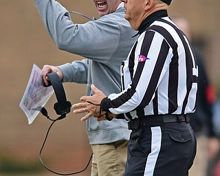 JACKSONVILLE, ALABAMA - DECEMBER 3, 2016: Head coach Bo Pelini of YSU disputes a call with the line judge during the first half of their game Saturday afternoon at Burgess-Snow Field. YSU won 40-24. DAVID DERMER | THE VINDICATOR