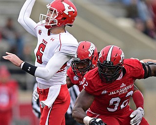 JACKSONVILLE, ALABAMA - DECEMBER 3, 2016: Quarterback Hunter Wells #6 of YSU throws a pass from the pocket avoiding pressured from the Jacksonville State defensive line during the first half of their game Saturday afternoon at Burgess-Snow Field. YSU won 40-24. DAVID DERMER | THE VINDICATOR