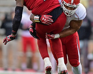 JACKSONVILLE, ALABAMA - DECEMBER 3, 2016: Quarterback Eli Jenkins #7 of Jacksonville State is hit by Derek Rivers #11 of YSU after releasing the ball during the first half of their game Saturday afternoon at Burgess-Snow Field. YSU won 40-24. DAVID DERMER | THE VINDICATOR