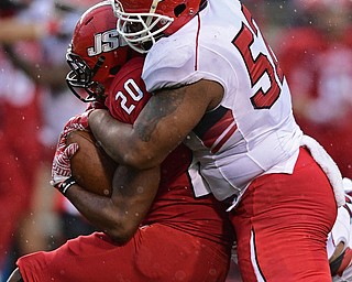 JACKSONVILLE, ALABAMA - DECEMBER 3, 2016: Defensive linemen Savon Smith #52 of YSU tackles running back Tyus Flakes #20 of Jacksonville State during the second half of their game Saturday afternoon at Burgess-Snow Field. YSU won 40-24. DAVID DERMER | THE VINDICATOR
