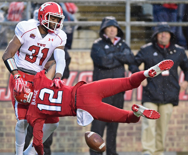 JACKSONVILLE, ALABAMA - DECEMBER 3, 2016: Defensive back David Rivers III throws receiver Josh Barge #12 of Jacksonville State to the turf after breaking up a pass on fourth down during the second half of their game Saturday afternoon at Burgess-Snow Field. YSU won 40-24. DAVID DERMER | THE VINDICATOR