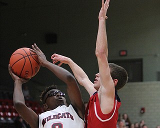 William D. Lewis The Vindicator Struthers' JKevin Traylor(3) shoots past Dylan Beany(21) of Fitch during 12062016 action at Struthers.