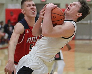 William D. Lewis The Vindicator Struthers' Ryan Leonard(20) Cole Constance(5) of Fitch fight for a rebound during 12062016 action at Struthers.