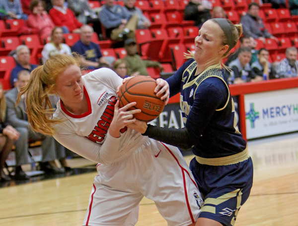 Youngstown State's Kelley Wright (35) tries to rip the ball away from Akron's Hannah Plybon (22) during the first half of Tuesday nigths matchup at the Beeghly Center.  Dustin Livesay  |  The Vindicator  12/6/16  Beeghly Center, YSU