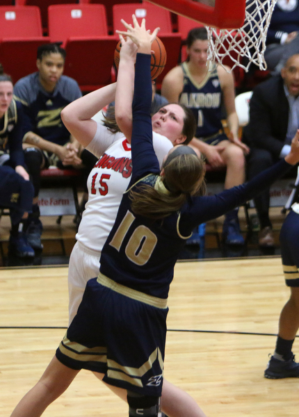 Youngstown State's Mary Dunn (15) goes up for a jump shot while being defended by Akron's Caitlin Vari (10) during the first half of Tuesday nigths matchup at the Beeghly Center.  Dustin Livesay  |  The Vindicator  12/6/16  Beeghly Center, YSU