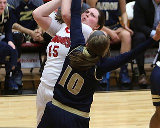 Youngstown State's Mary Dunn (15) goes up for a jump shot while being defended by Akron's Caitlin Vari (10) during the first half of Tuesday nigths matchup at the Beeghly Center.  Dustin Livesay  |  The Vindicator  12/6/16  Beeghly Center, YSU