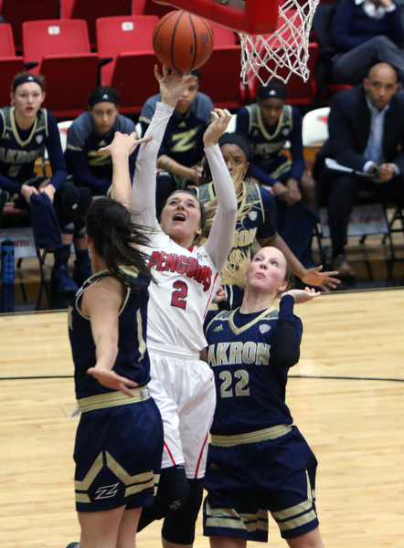 Youngstown State's Alison Smolinski (2) goes up for a jump shot while being defended by Akron's Alli Ball (1) and Hannah Plybon (22) during the first half of Tuesday nigths matchup at the Beeghly Center.  Dustin Livesay  |  The Vindicator  12/6/16  Beeghly Center, YSU
