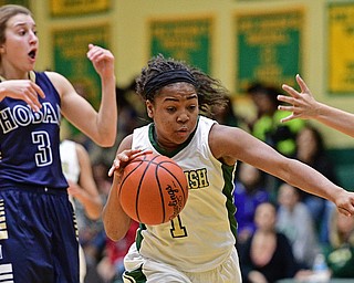 YOUNGSTOWN, OHIO - DECEMBER 7, 2016: Dayshanette Harris #1 of Ursuline drives to the basket after getting around Emma Tecca #3 of Hoban during the first half of their game Wednesday night at Ursuline High School. DAVID DERMER | THE VINDICATOR