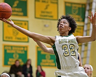 YOUNGSTOWN, OHIO - DECEMBER 7, 2016: Simone Comer #32 of Ursuline goes to the basket during the second half of their game Wednesday night at Ursuline High School. DAVID DERMER | THE VINDICATOR