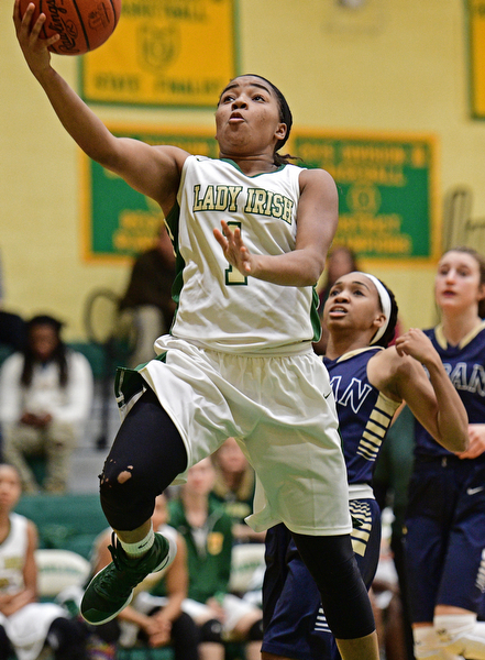 YOUNGSTOWN, OHIO - DECEMBER 7, 2016: Dayshanette Harris #1 of Ursuline goes to the basket during the second half of their game Wednesday night at Ursuline High School. DAVID DERMER | THE VINDICATOR