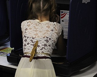 Neighbors | Abby Slanker.A Canfield Village Middle School student filled out her presidential ballot in a voting booth during the school’s mock presidential election Oct. 28.