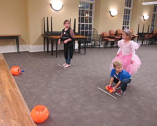 Neighbors | Alexis Bartolomucci.The children at the Halloween Howls program on Oct. 25 at the Poland library played a beanbag pumpkin toss.