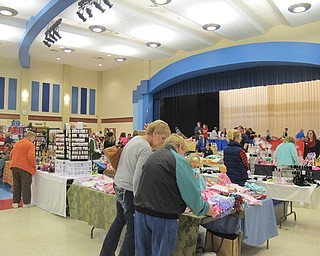 Neighbors | Alexis Bartolomucci.Guests at the Austintown Middle School craft show on Nov. 12 shopped around for different items vendors had for sale.