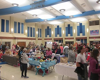 Neighbors | Alexis Bartolomucci.Vendors set up tables all over Austintown Middle School for the annual craft show on Nov. 12.