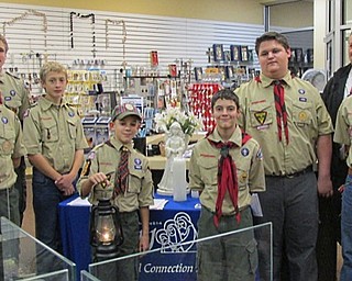 Neighbors | Submitted.Last year members of Boy Scout Troop 22 of Youngstown transferred the International Peace Light to the owners, Dora Jean and Stephan Havrilla of the JMJ Spiritual Connections II store in Cornersburg. Participating in the ceremony were, from left, Anson Hankey, Tyler Bartell, Ryan Brooks, Aden Hankey Michael Curry, Rocco Shasho, Asst. Scoutmaster Ron Brooks and Scoutmaster Jim Bartell.