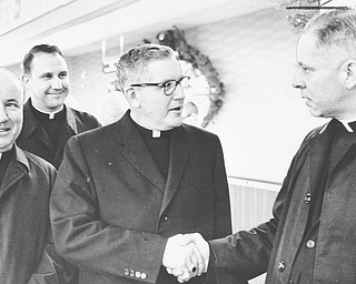 12121965 Bishop James Malone (3rd from left) is greted by Rev Msgr John Lettau of St. Edward Church at the Youngstown Airport after retuning from Vatican II Council in Rome.
