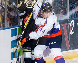 Scott R. Galvin | Vindicator.Youngstown Phantoms forward Coale Norris (44) checks a Muskegon Lumberjacks player into the boards during the first period at the Covelli Centre on Dec. 8, 2016. The Phantoms lost 4-3 in overtime.