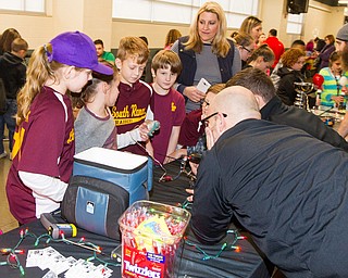 Scott R. Galvin | Vindicator.Students from South Range school play with robotics during the second intermission of the hockey game between the Youngstown Phantoms and the Muskegon Lumberjacks at the Covelli Centre on Dec. 8, 2016. The Phantoms hosted the annual School Days game for students in schools from around the area. The Phantoms lost 4-3 in overtime.