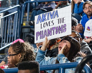 Scott R. Galvin | Vindicator.A student from cheers on the Youngstown Phantoms during the third period against the Muskegon Lumberjacks at the Covelli Centre on Dec. 8, 2016. The Phantoms hosted the annual School Days game for students in schools from around the area. The Phantoms lost 4-3 in overtime.