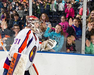 Scott R. Galvin | Vindicator.Youngstown Phantoms goalie Ivan Kulbakov (31) high-fives students through the glass after the game against the Muskegon Lumberjacks at the Covelli Centre on Dec. 8, 2016. The Phantoms hosted the annual School Days game for students in schools from around the area. The Phantoms lost 4-3 in overtime.