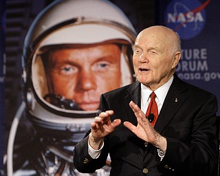FILE - In this Feb. 20, 2012, file photo, U.S. Sen. John Glenn talks with astronauts on the International Space Station via satellite before a discussion titled "Learning from the Past to Innovate for the Future" in Columbus, Ohio. Glenn, who was the first U.S. astronaut to orbit Earth and later spent 24 years representing Ohio in the Senate, has died at 95. (AP Photo/Jay LaPrete, File)