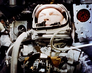 In this Feb. 20, 1962 photo made available by NASA, astronaut John Glenn pilots the "Friendship 7" Mercury spacecraft during his historic flight as the first American to orbit the Earth. Glenn, who later spent 24 years representing Ohio in the Senate, has died at 95. (NASA via AP)