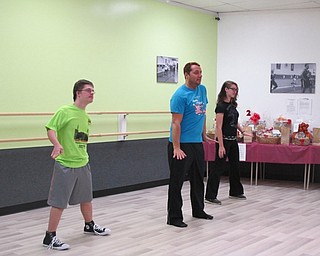 Neighbors | Alexis Bartolomucci.Viktor Slipski learned dance moves from instructor Paul Miletta during his hip-hop class at Limitless Dance Company on Nov. 9.