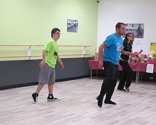 Neighbors | Alexis Bartolomucci.Paul Miletta taught Viktor Slipski different steps durng hip-hop class at Limitless Dance Company on Nov. 9.