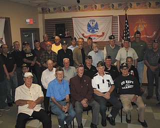 SPECIAL TO THE VINDICATOR
VFW Post 9571 hosted its open house Oct. 15 with the theme “Welcome Home” to let veterans know their service is appreciated. More than 50 veterans received a “Welcome Home” with a handshake and mementos. Each veteran was given a token with a picture of the Statue of Liberty and the San Francisco Bridge with the inscription, “VFW Welcomes You Home.” On the reverse was inscribed “Service-Sacrifice, We Will Not Forget” and “You took Freedom to Distant Lands and Gave Hope to a World Oppressed.” The second memento was a pin of a casket draped with the American flag inscribed with “In God’s Hands Now” as a reminder of those who sacrificed their lives. Some of those attending the event, in front from left, are Larry Spencer, Homer Marsh, Dan King, Bernard Check and Jim Duffett. In row two are Bill Garritano, Keith August, Melvin Megown, John Craig, Jim Tornicasa and Dan Turk. And in back are Ty Everhart, Leonard Martin, Bob Kanpp, Thomas Moenich, Fred Schrock, John Stool, Keith Fry, Neil Rulong, Mike Markel, Fred Eichorn, Jeffery Corbett, Rich Hopkins, Fred Holloway, Bob Bakalik, Don Schrock, Tom Check, Ray Schafer and Ken Calhoun.