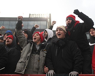 .Justin Summer(beige hat) and Mario Change(red hat left) cheer during the first half as Youngstown State takes on Wofford College in the FCS quarterfinals at Stambaugh Stadium in Youngstown on Saturday, Dec. 10, 2016. Youngstown State won in double overtime, 30-23, advancing to the semifinals...(Nikos Frazier | The Vindicator)..