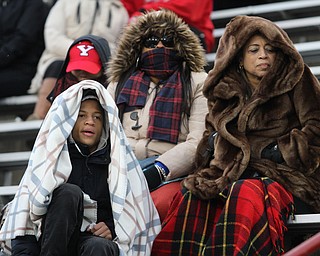 (top) Kaaylynn Posey, Christina Randall, Sandra Randall and Justin Posey(bottom) watch Sandra's son, Christiaan Posery (35) during the second half as Youngstown State takes on Wofford College in the FCS quarterfinals at Stambaugh Stadium in Youngstown on Saturday, Dec. 10, 2016. Youngstown State won in double overtime, 30-23, advancing to the semifinals...(Nikos Frazier | The Vindicator)..